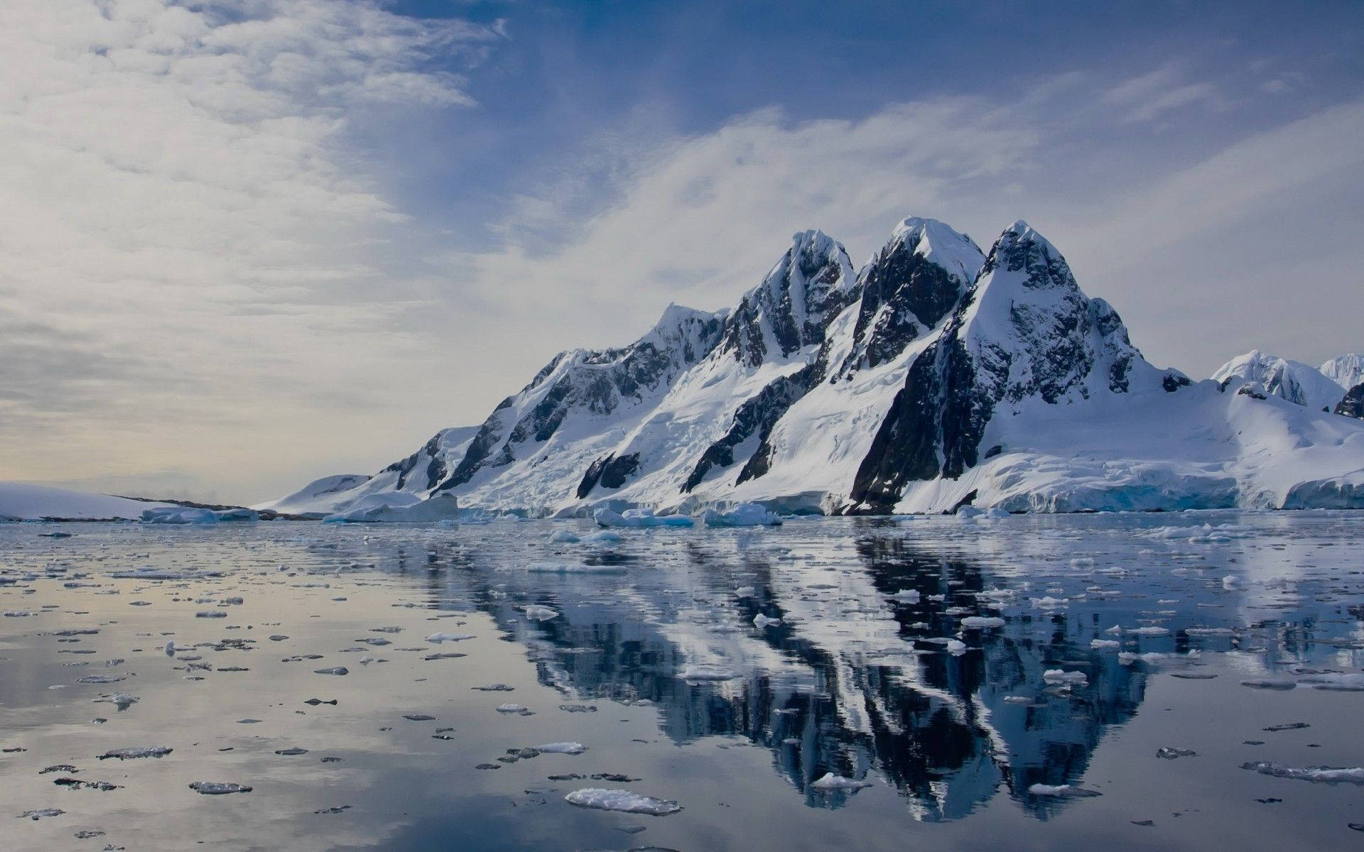 Antarctica Ice Covered Towering Mountains Background