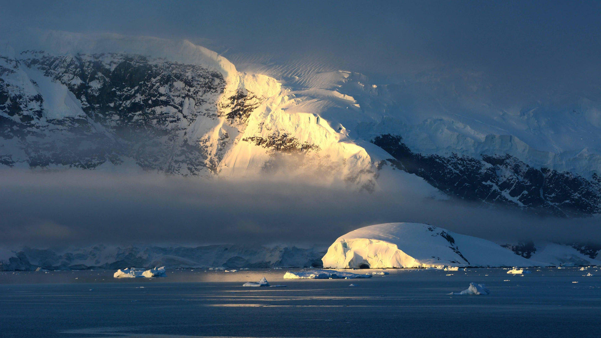 Antarctica Mountain Illuminated By Sunlight Background