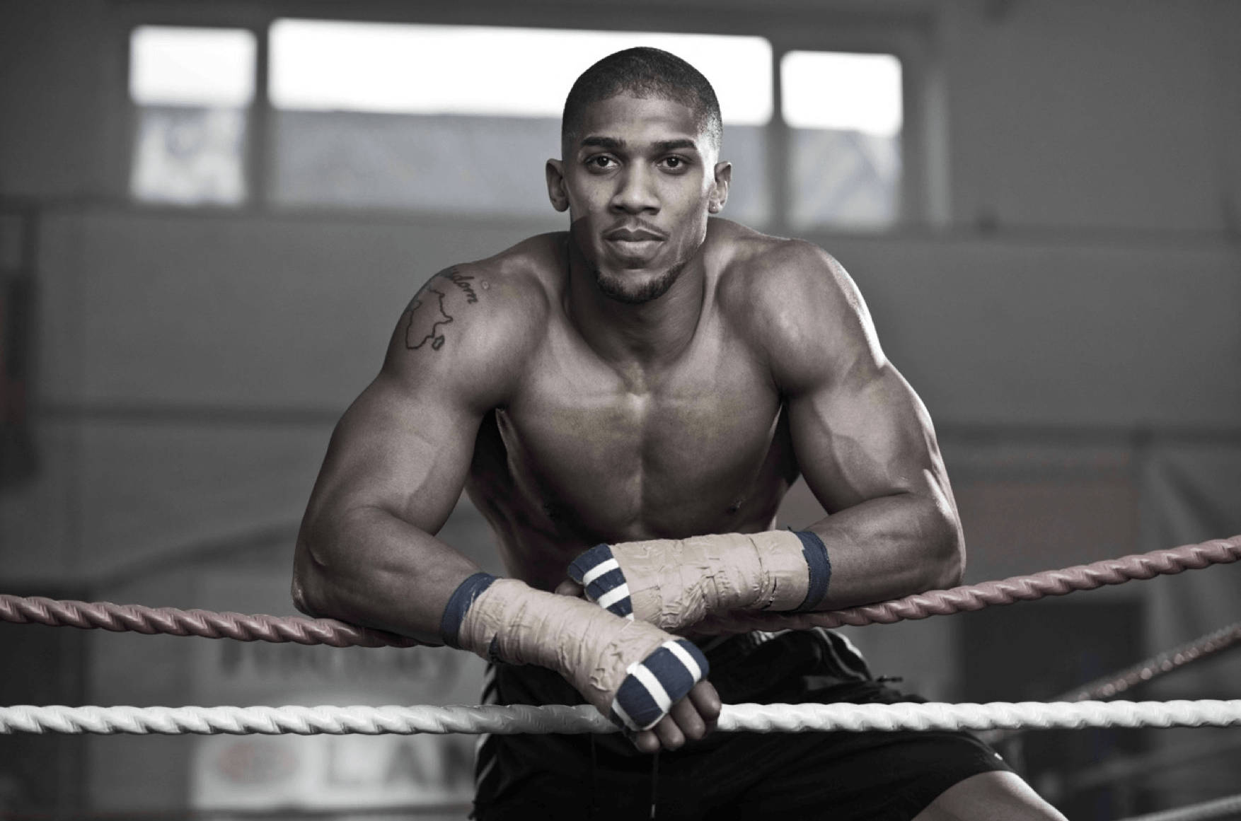 Anthony Joshua Leaning On Ropes Background