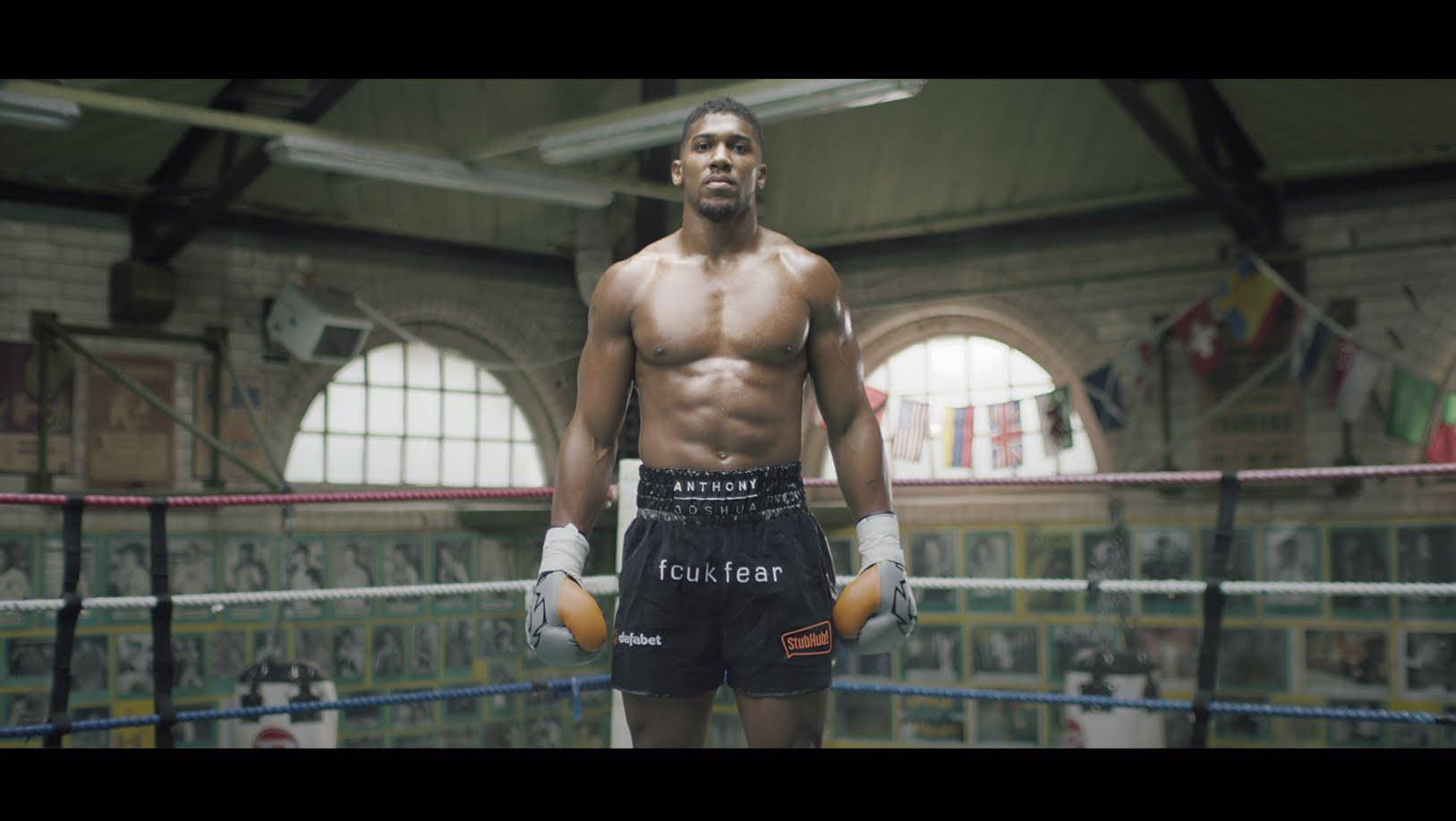 Anthony Joshua Muscular Abs Standing Background