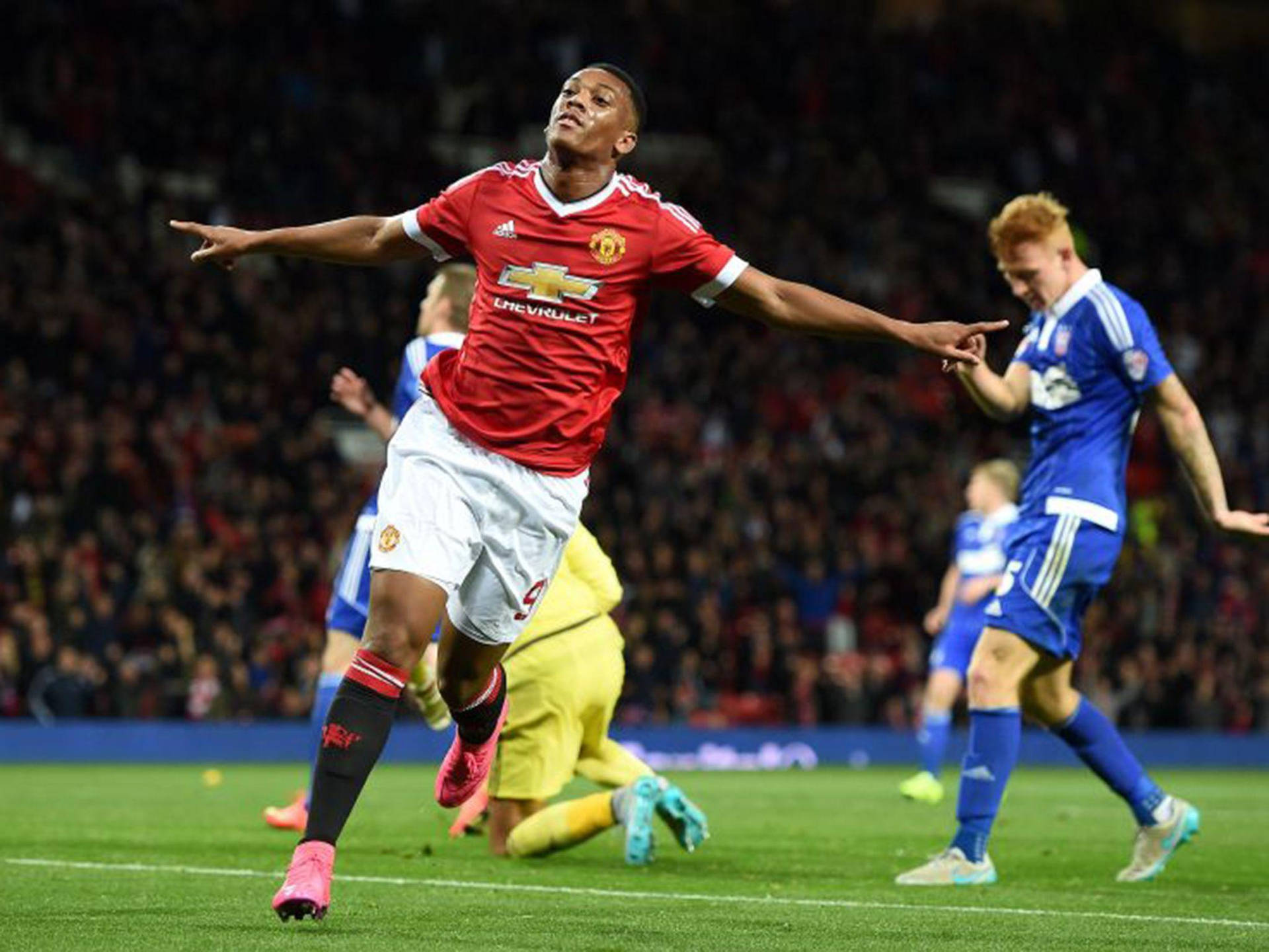 Anthony Martial Celebrating Arms Wide Open Background