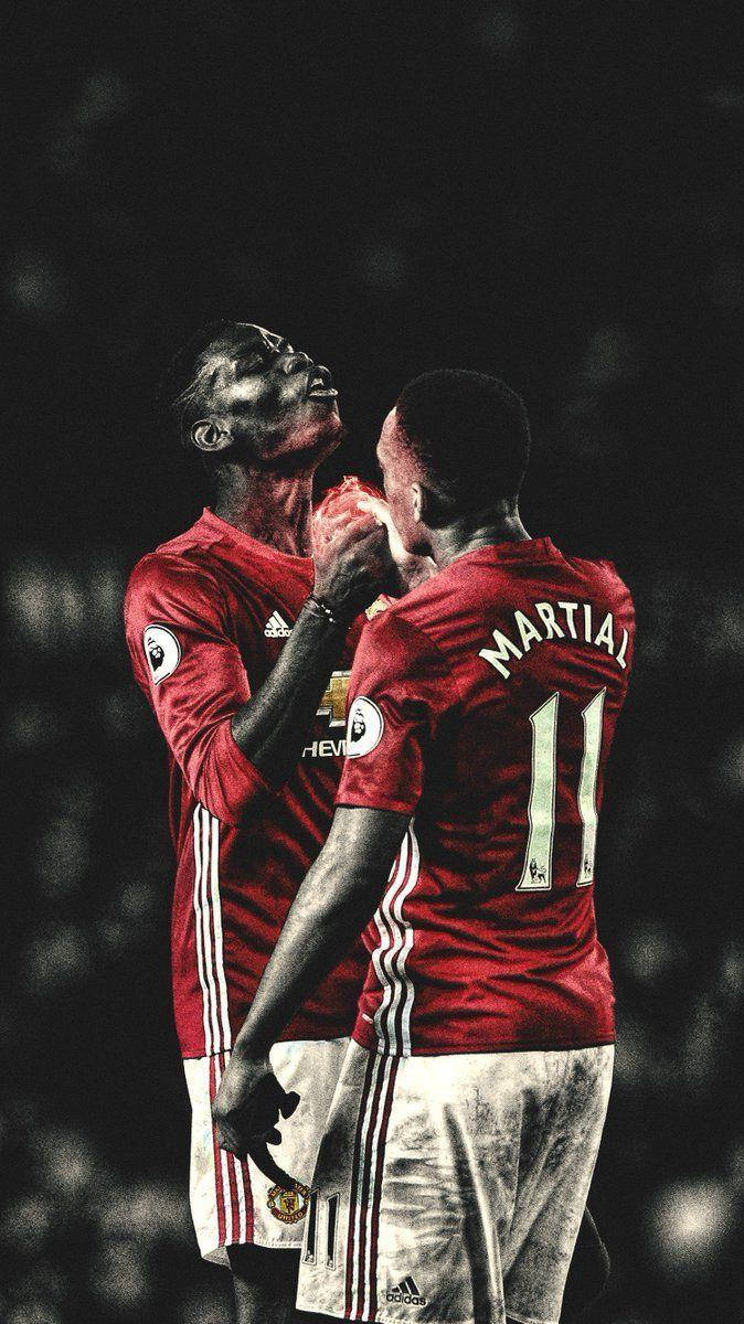 Anthony Martial Holding Hands Teammate Background