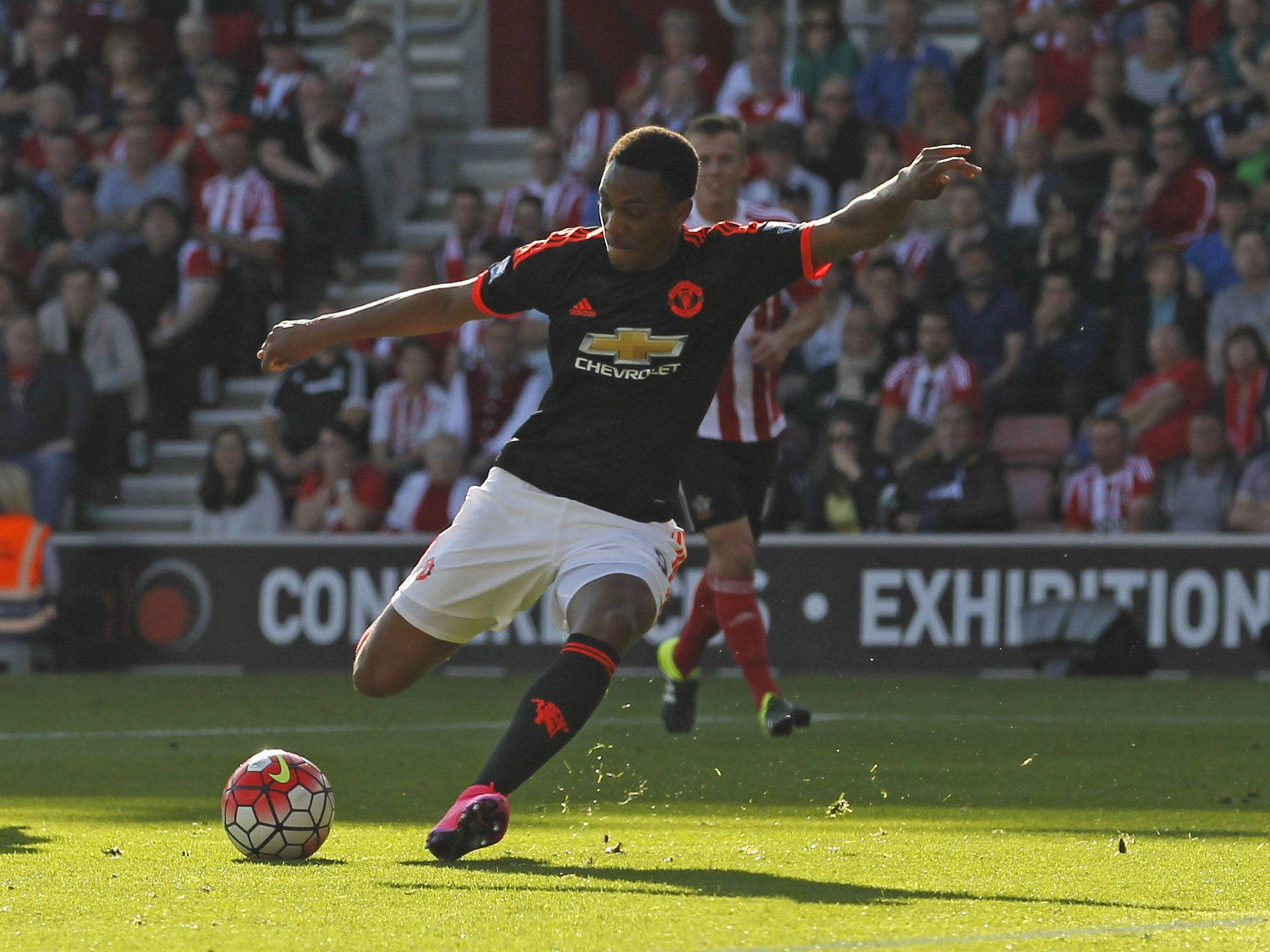 Anthony Martial Kicking Ball Background