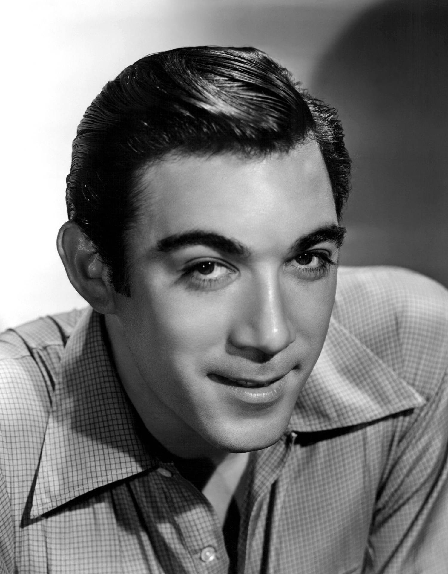 Anthony Quinn Tantalizing Smirk Background