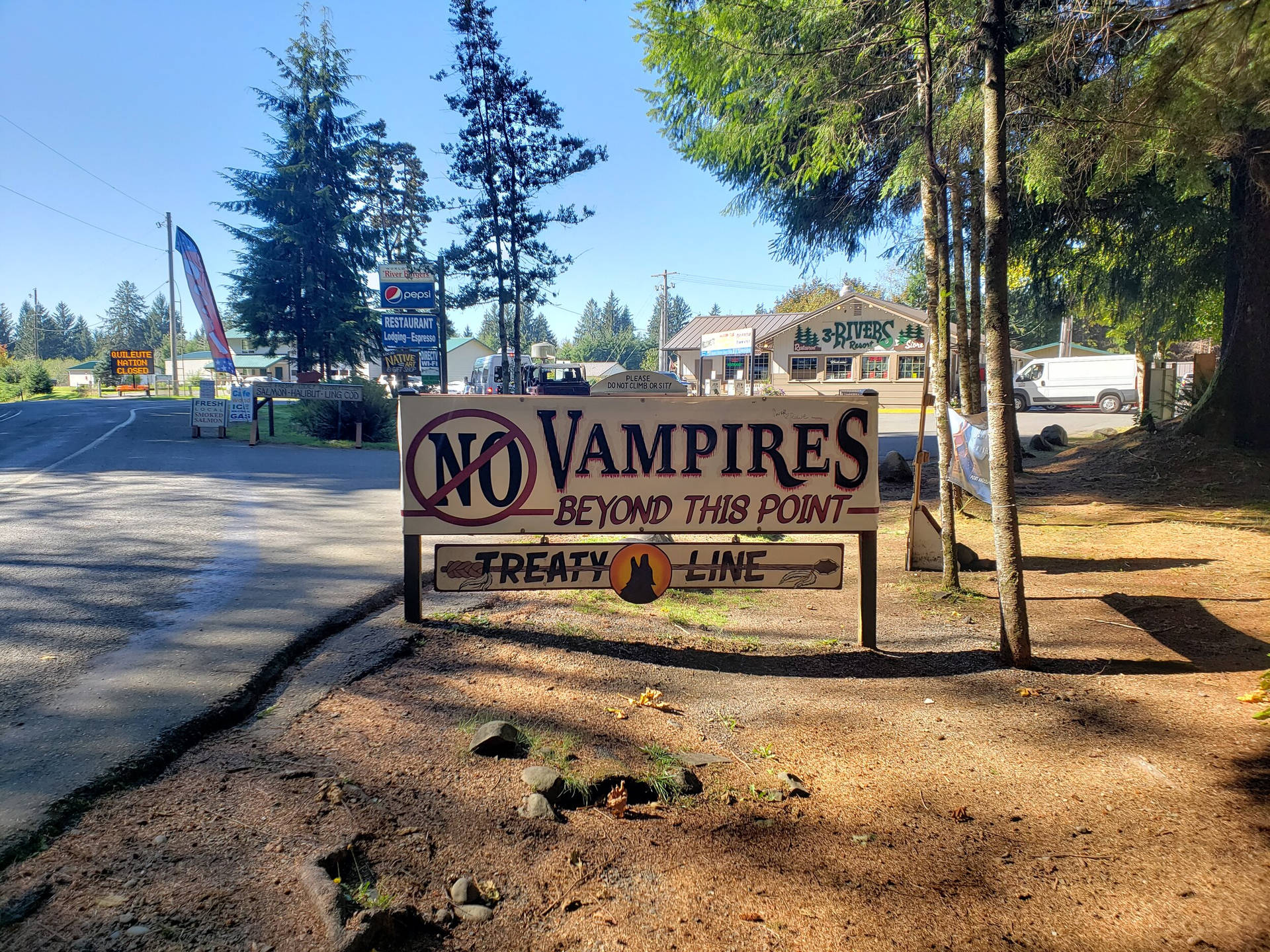 Anti-vampire Banner Featuring The Town Name In Forks, Washington. Background