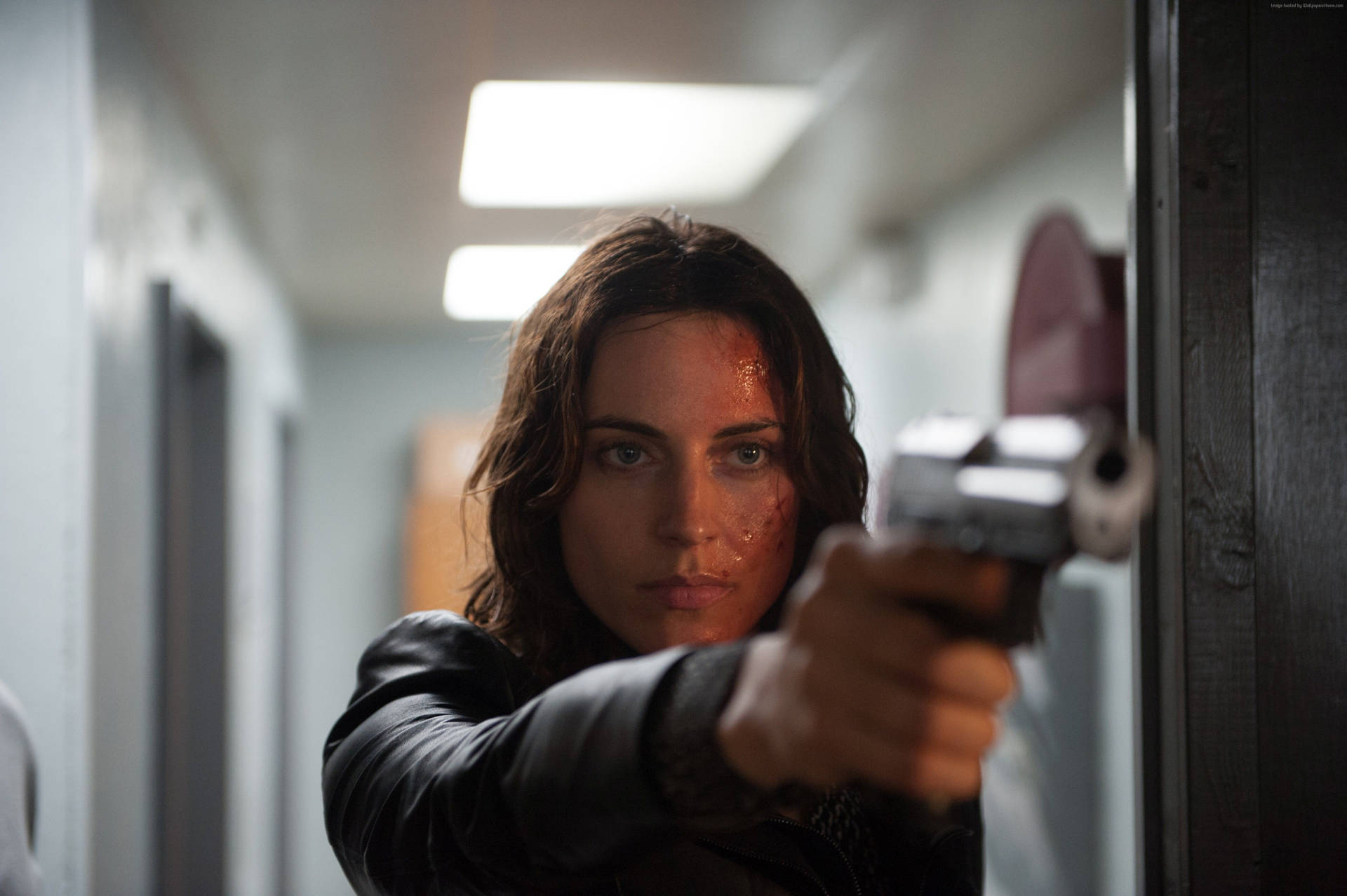 Antje Traue In A Bloody Battle Background