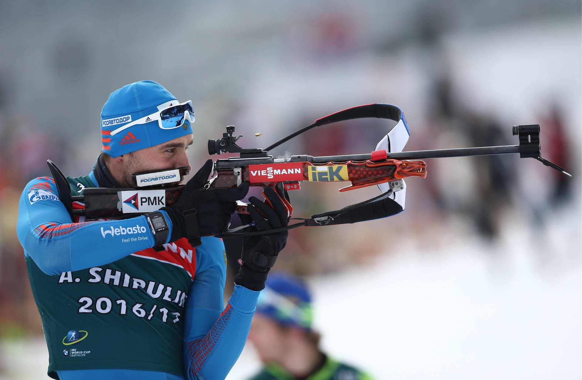 Anton Shipulin Competing At Biathlon World Championships Background