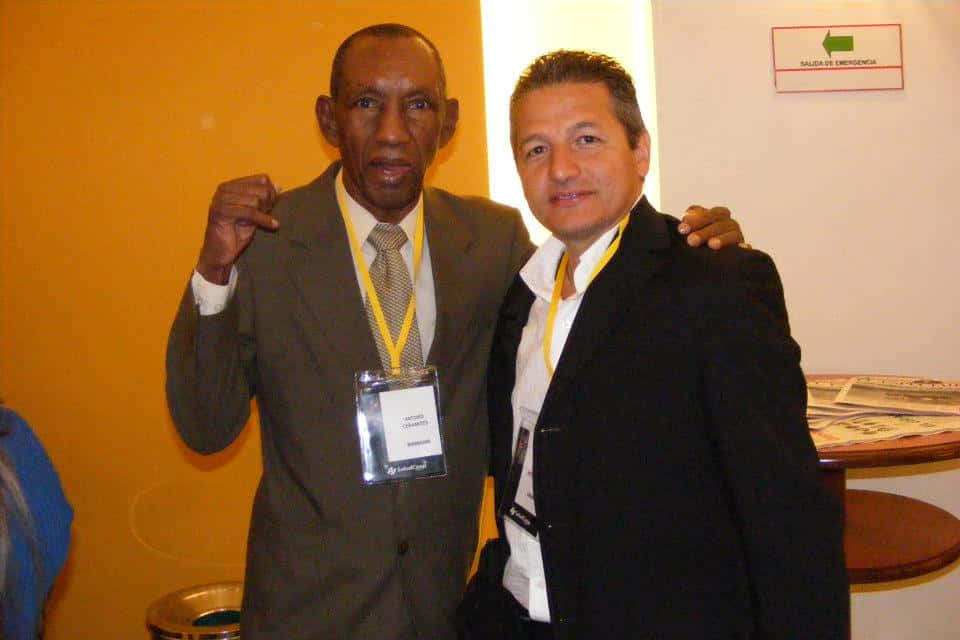 Antonio Cervantes Wearing Dark Gray Suit Background