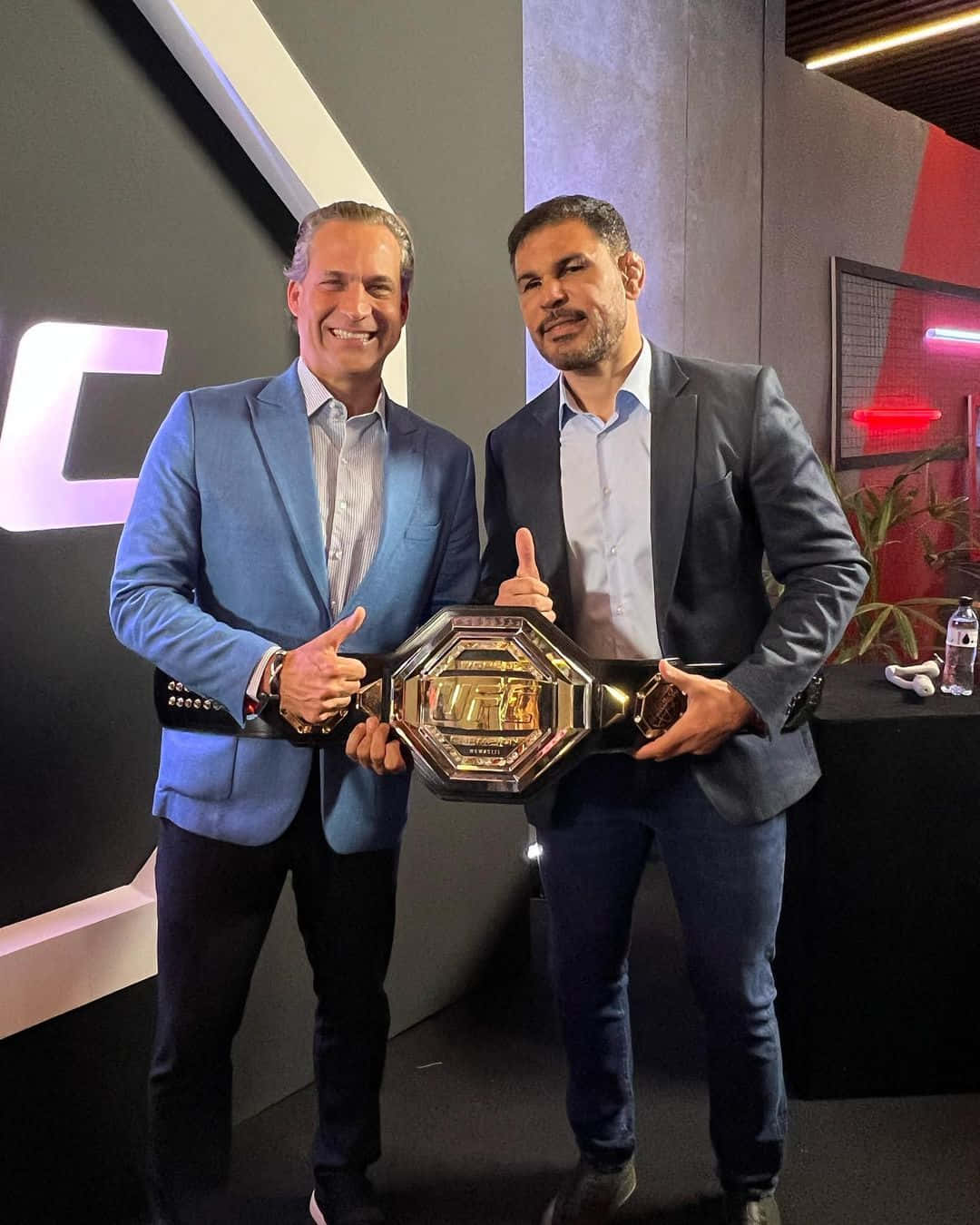 Antônio Rodrigo Nogueira Celebrating Victory With Belt Background