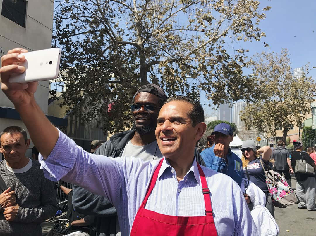 Antonio Villaraigosa Taking Picture Background