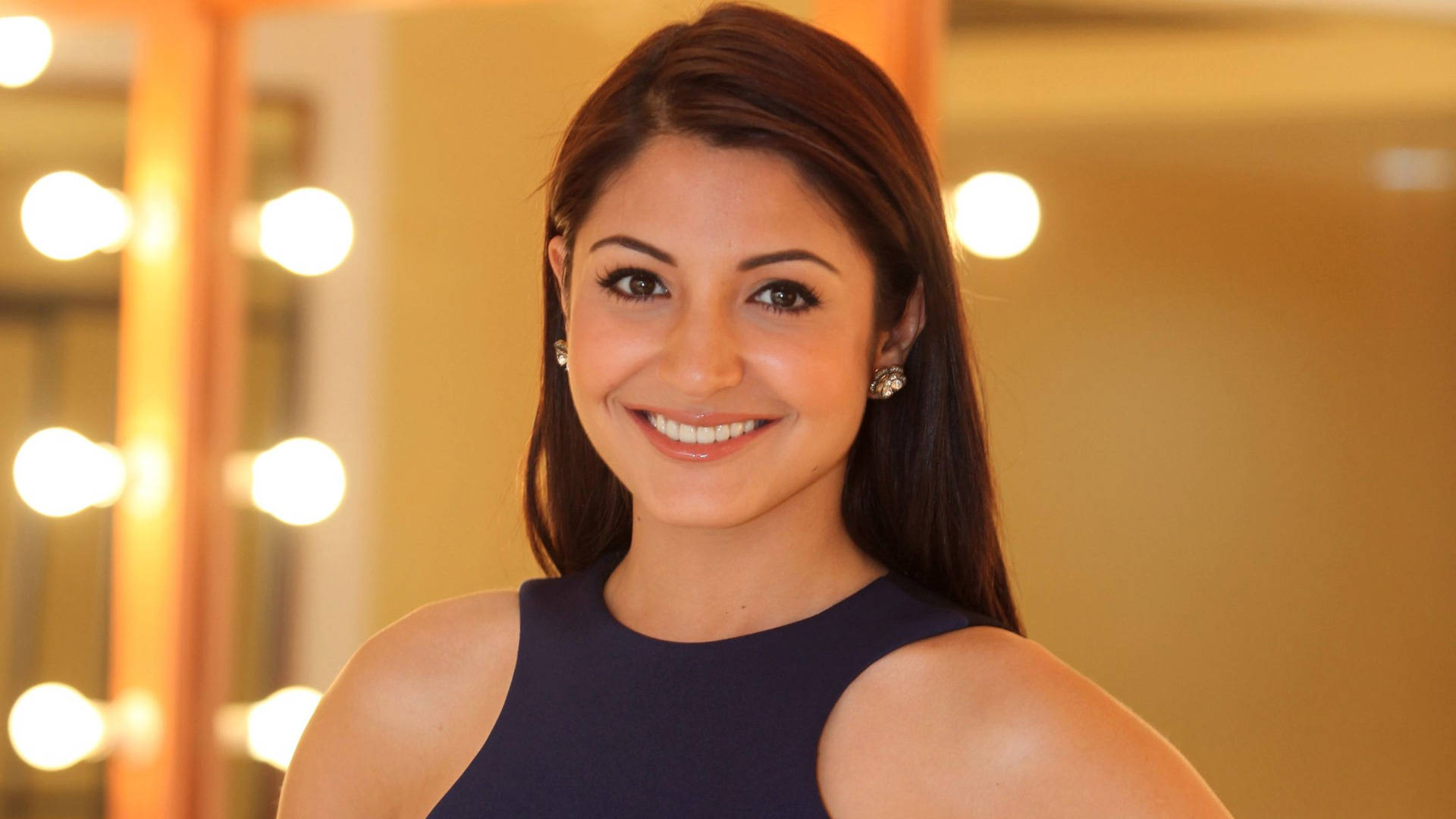 Anushka Sharma Beaming With Smile Background