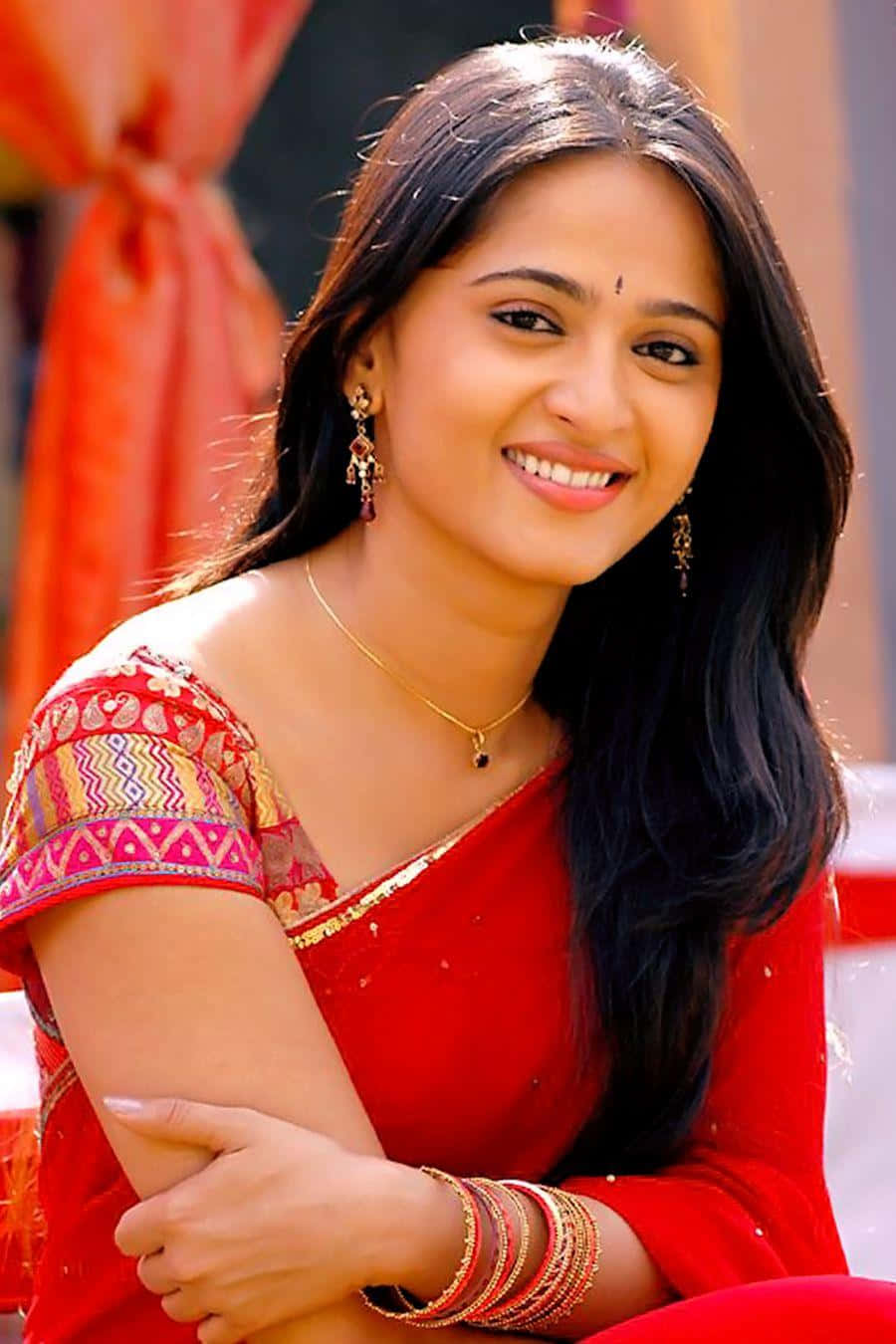 Anushka Shetty Red Traditional Attire Background