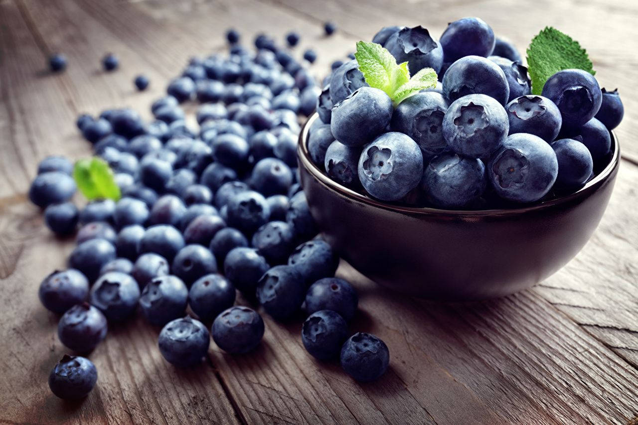 Appetizing Bowl Of Blueberries Background