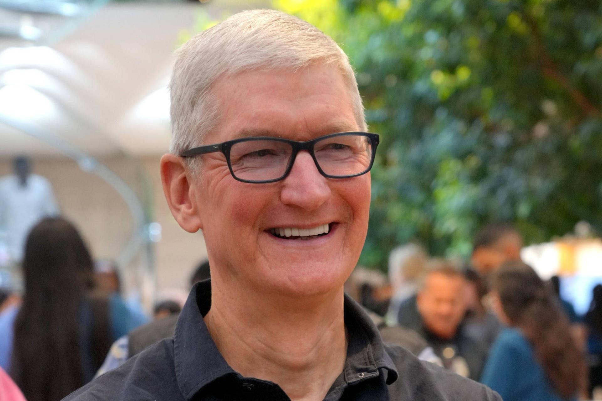 Apple Ceo Tim Cook Captured In Action Background