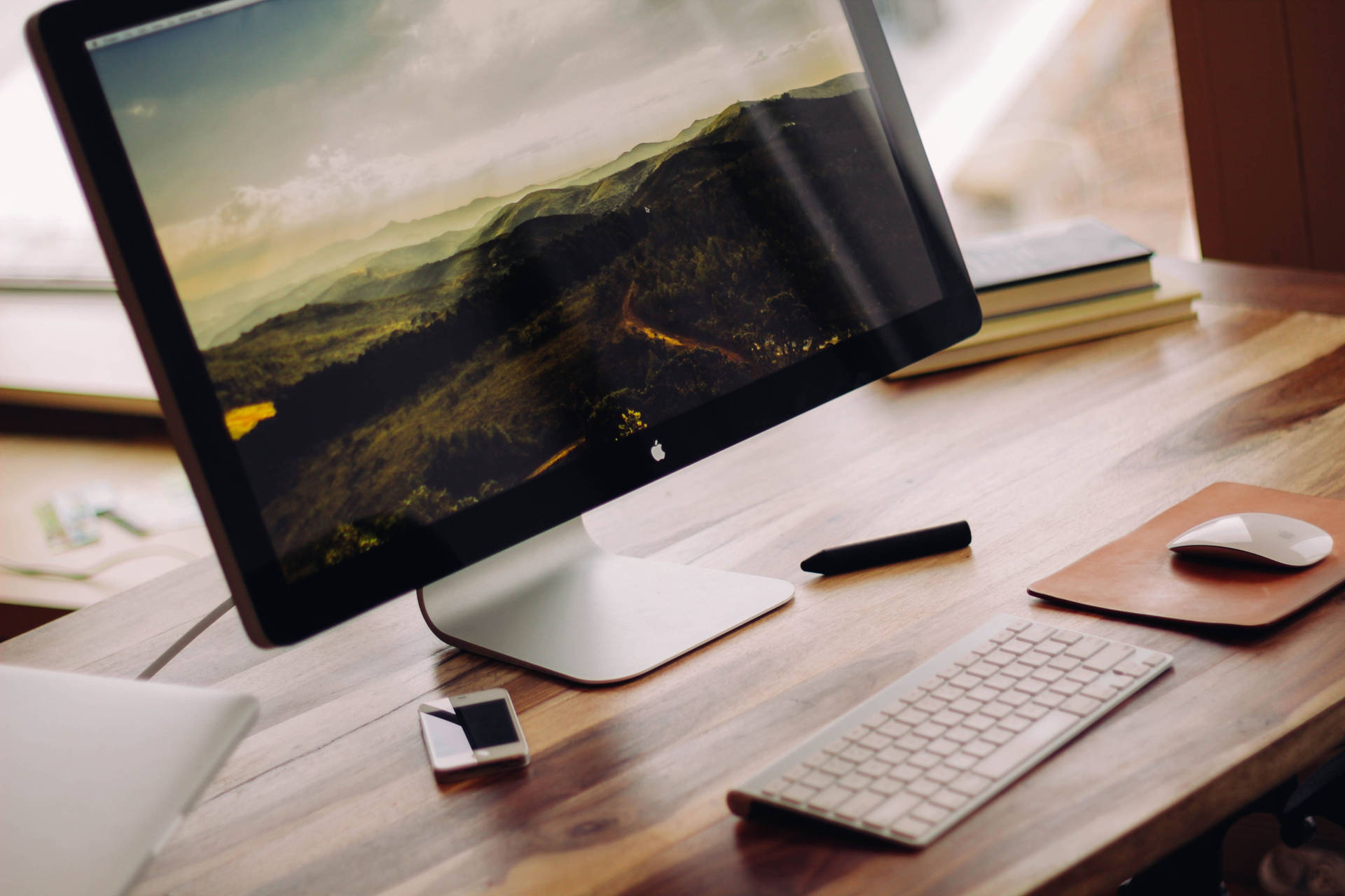 Apple Desktop On Wooden Office Desk Background