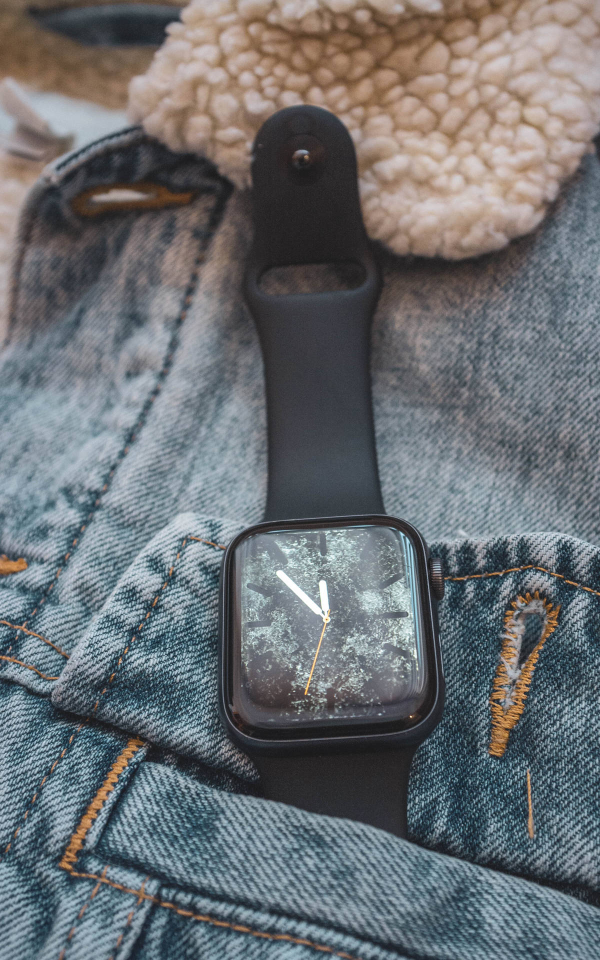 Apple Smartwatch On Denim Jacket Background