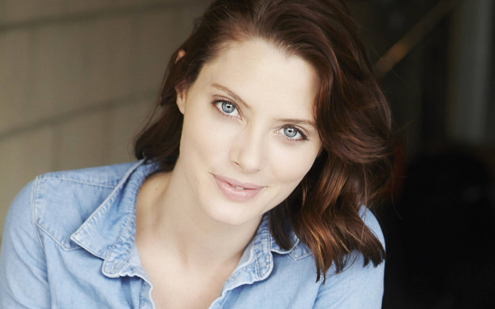 April Bowlby Donning A Denim Top Background