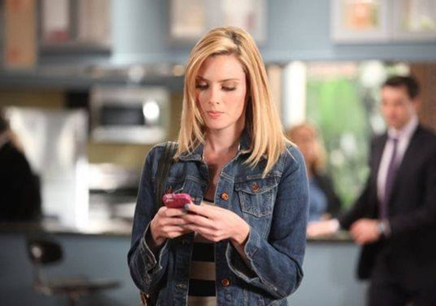 April Bowlby Using A Phone