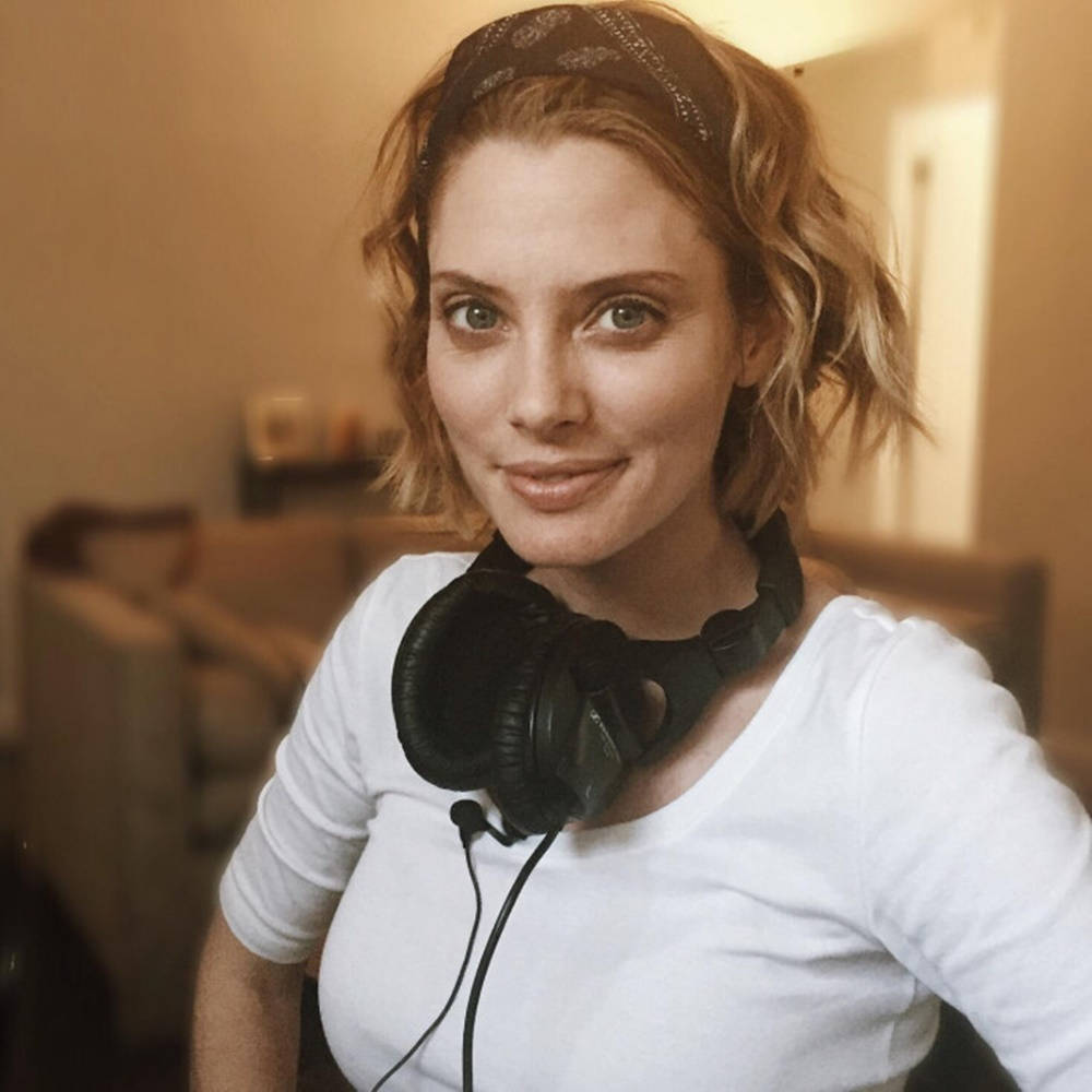 April Bowlby Wearing Headphones