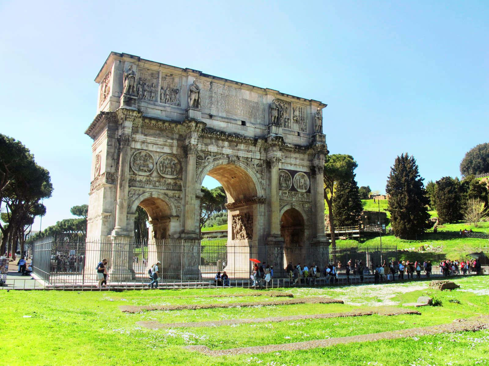 Arch Of Constantine Surrounded By Tourists Background