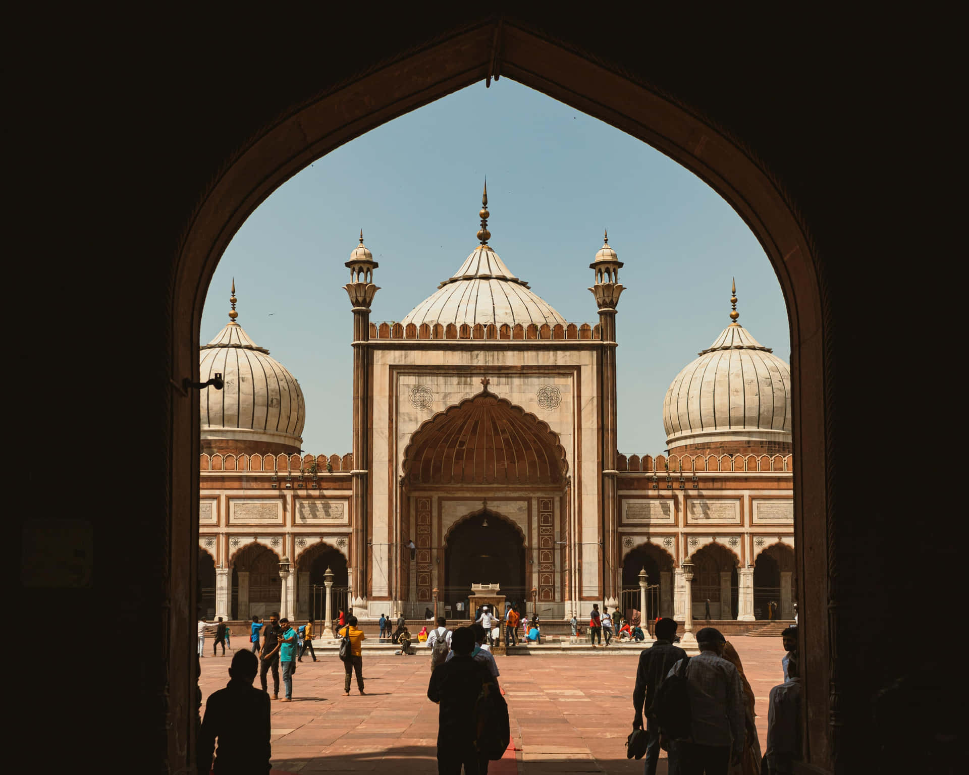 Arched_ View_of_ Masjid_ Complex Background