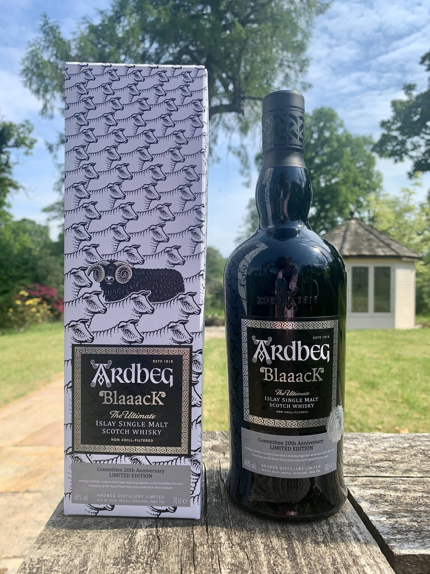 Ardbeg Blaaack Whisky Bottle And Box In Garden Background