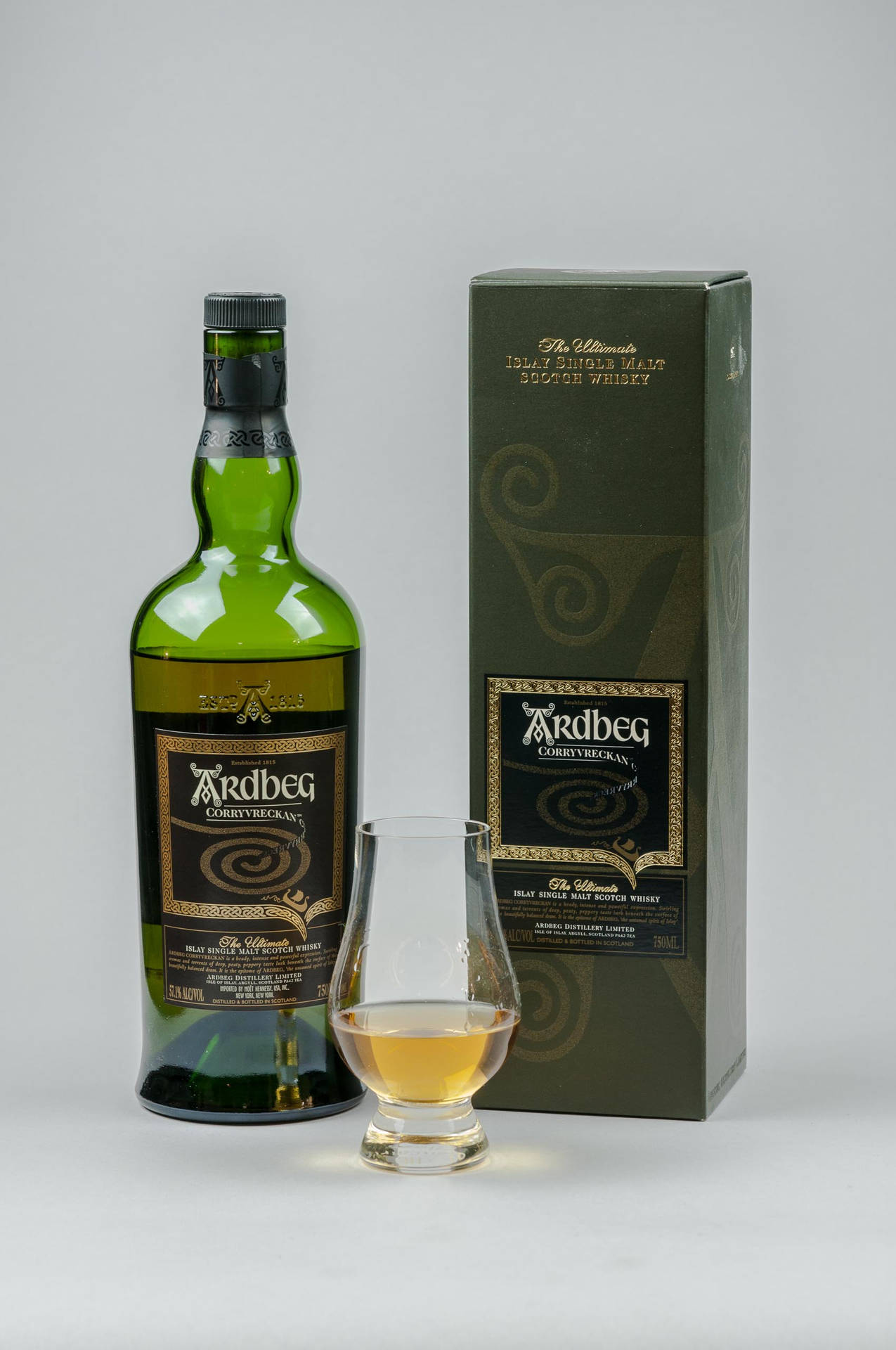 Ardbeg Corryvreckan Whisky Bottle With Shot Glass Background