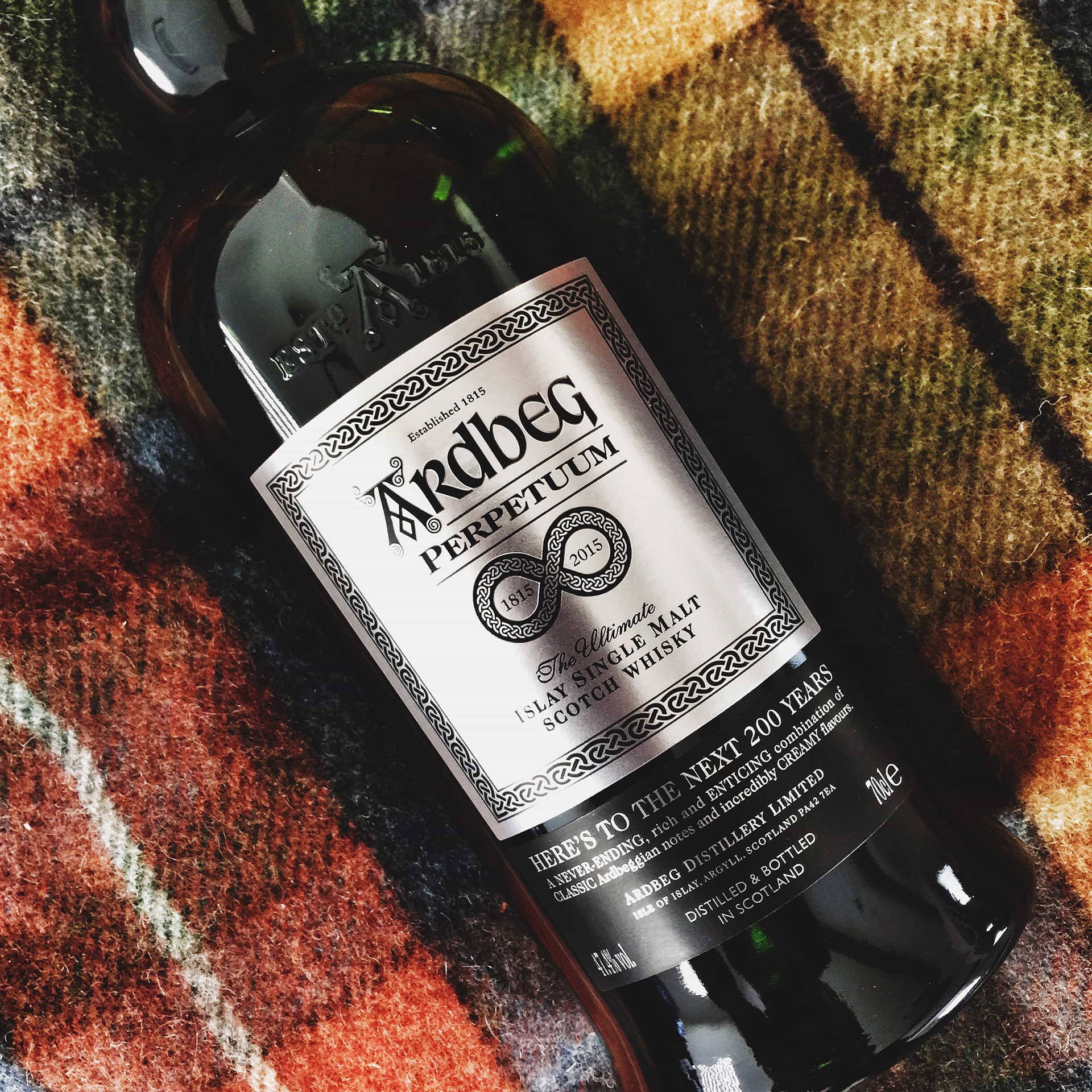 Ardbeg Perpetuum Whisky Bottle On Picnic Scarf