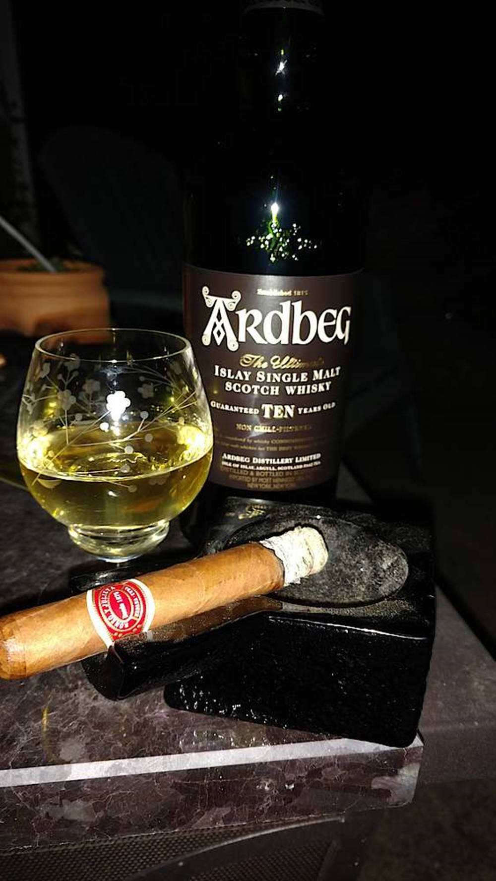 Ardbeg Whisky Bottle And Cigarette Background