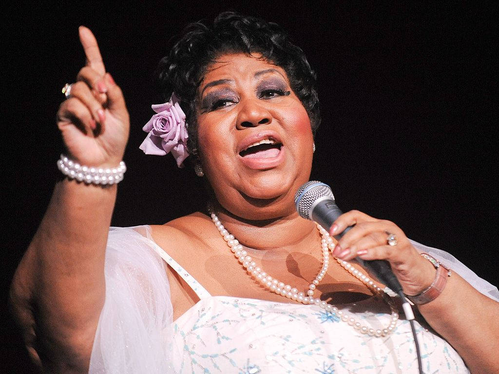 Aretha Franklin, Elegant And Soulful, Bearing A Single Rose Background