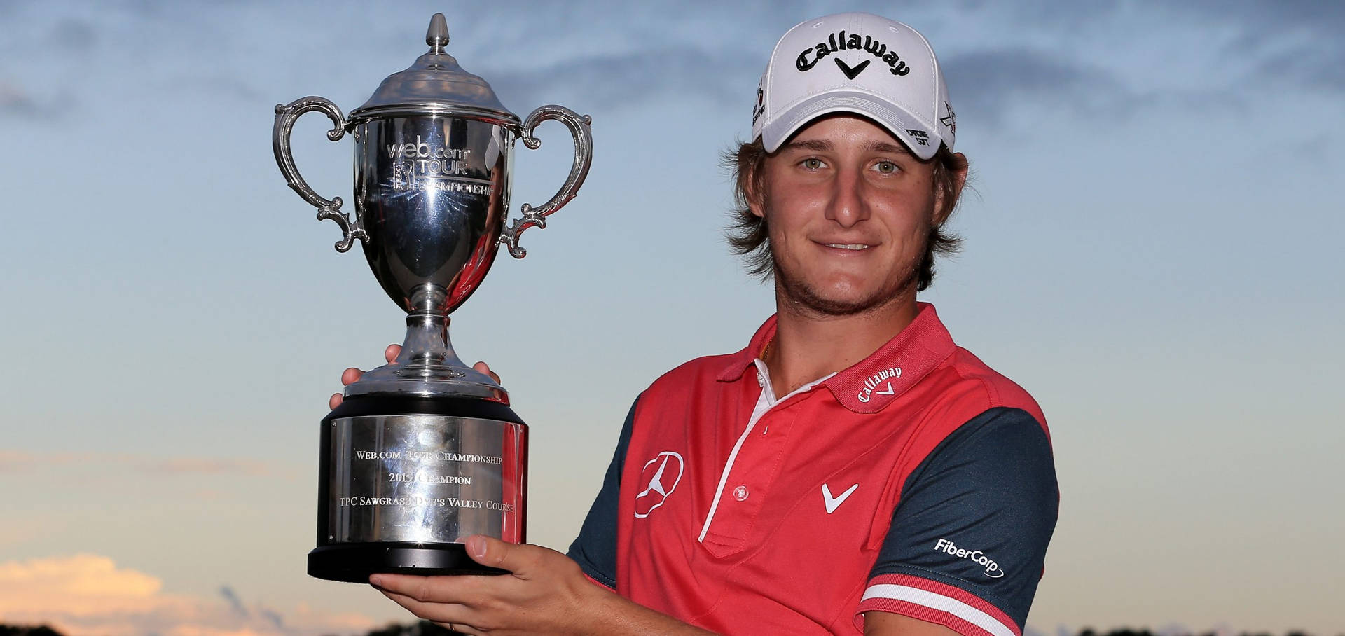 Argentinian Golf Pro Emiliano Grillo Taking A Swing Background