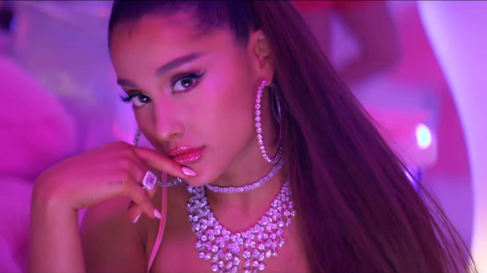 Ariana Grande Dancing In Front Of A Rainbow With Her 7 Rings As She Celebrates 2019 Background