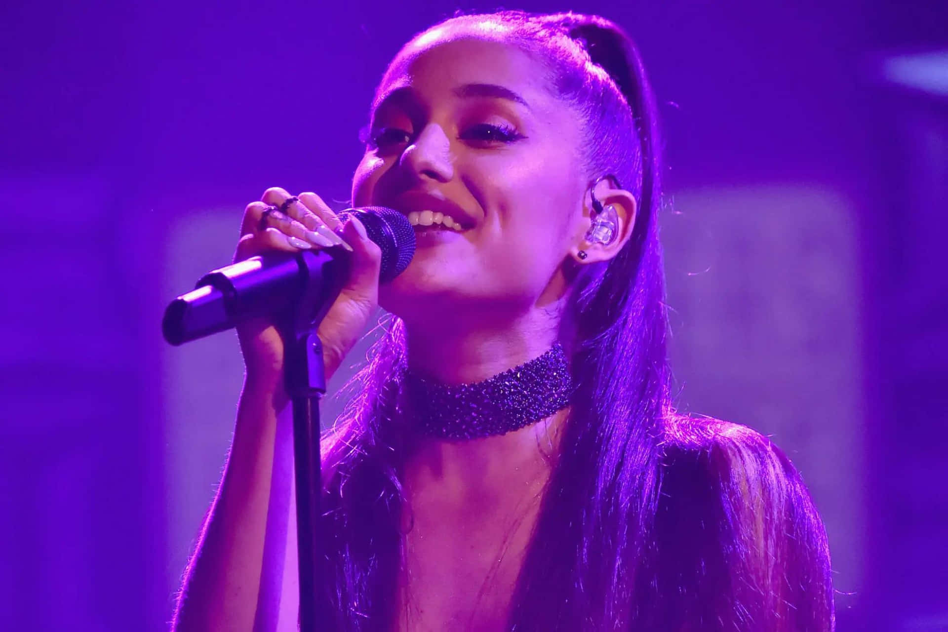 Ariana Grande Performing Live Background
