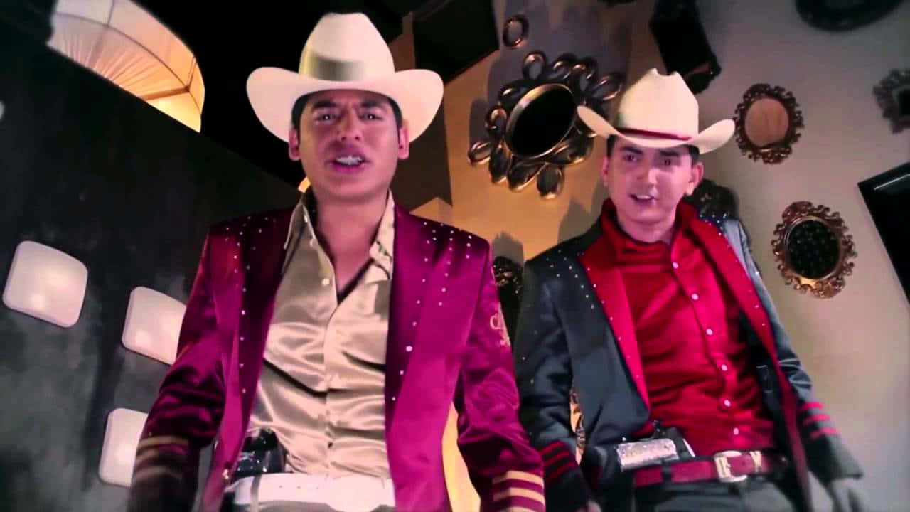 Ariel Camacho Strumming His Signature Guitar. Background