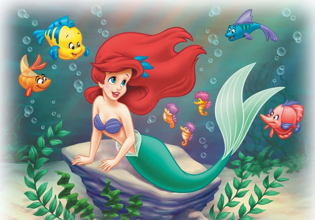 Ariel, The Little Mermaid, Dreamily Exploring A Magical Underwater World Background