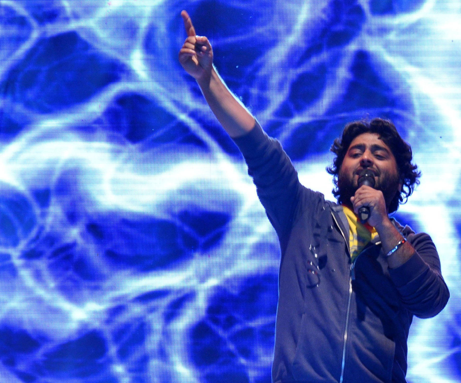 Arijit Singh Performing On Stage Background