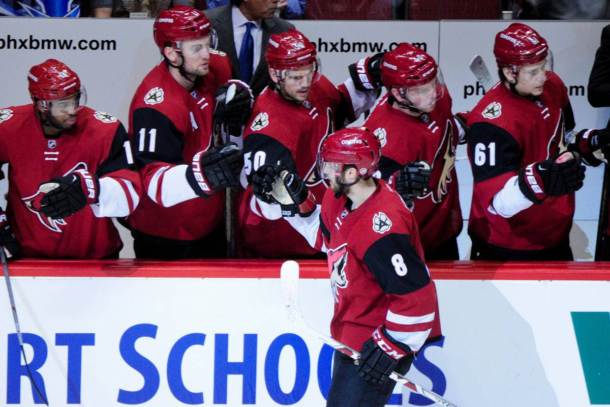 Arizona Coyotes In Red And Black Jersey Background