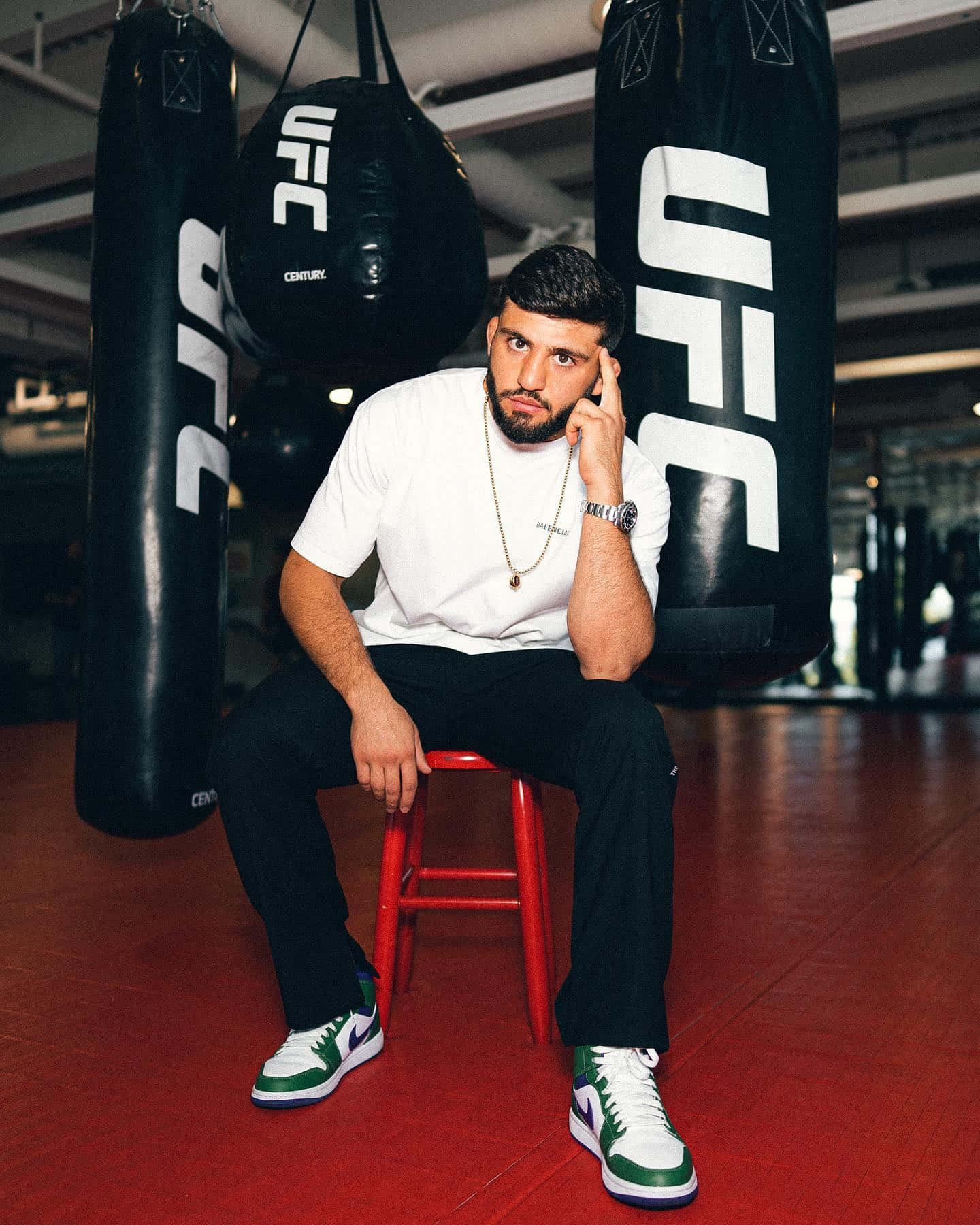 Arman Tsarukyan Sitting Near Punching Bags Background