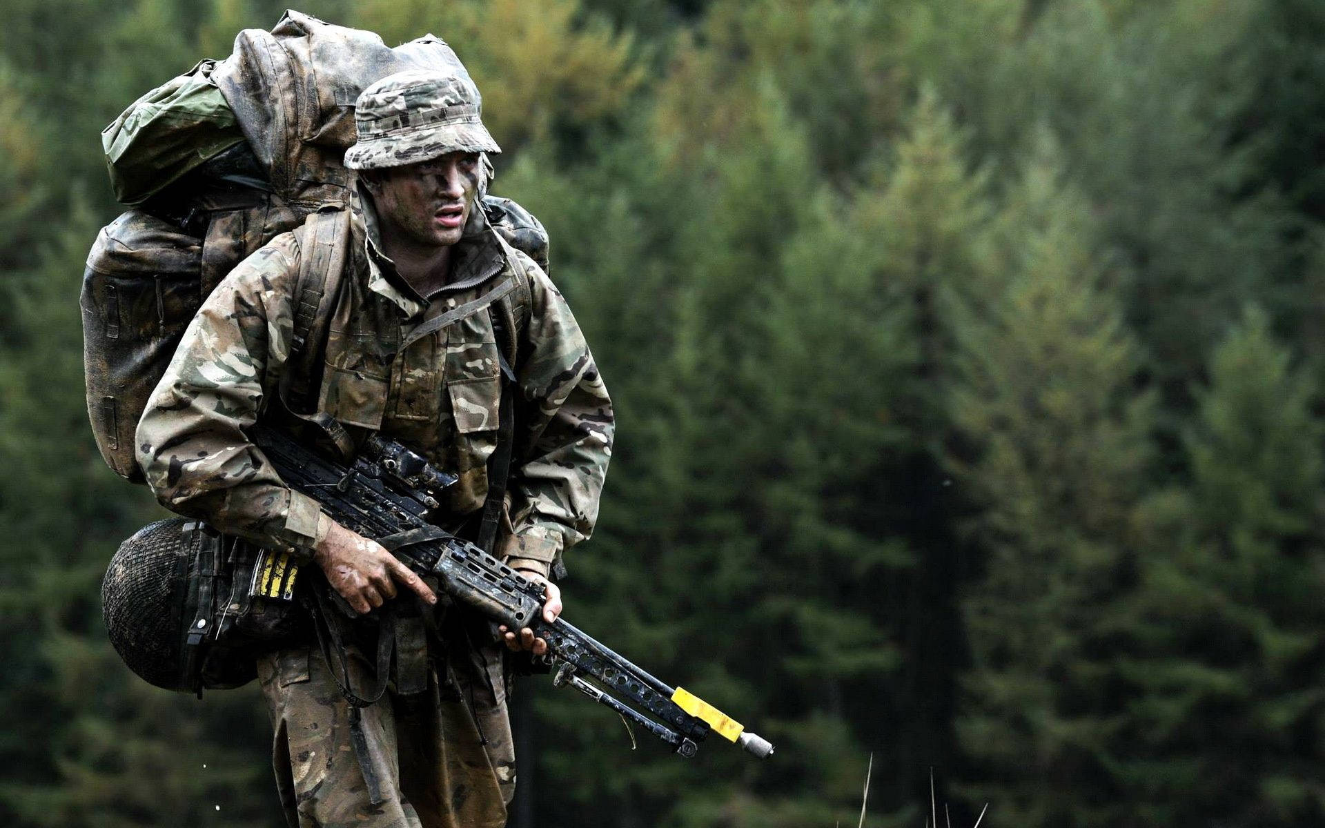 Armed Military In Forest Background