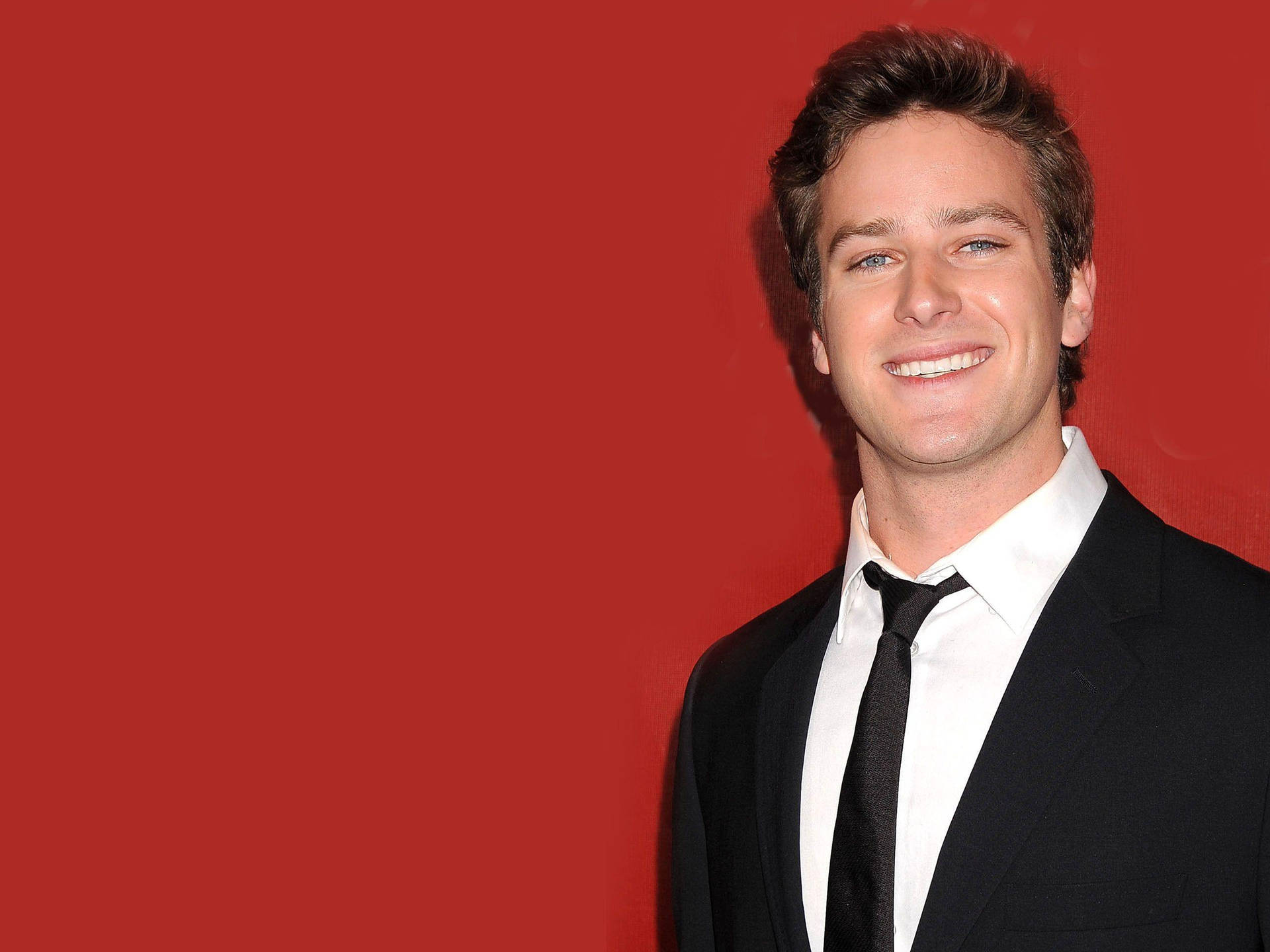 Armie Hammer In Red Background Background