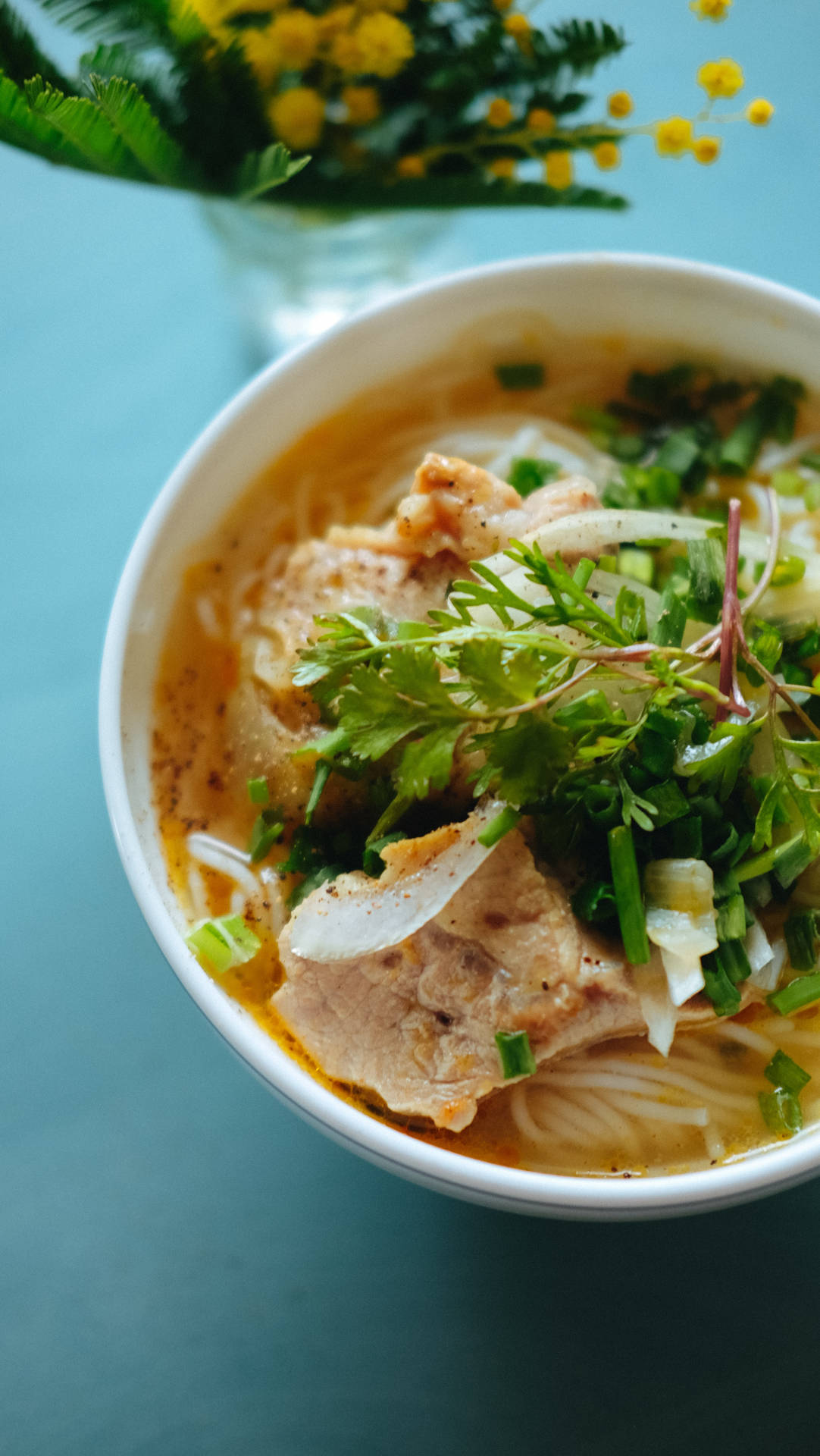 Aromatic Pho Soup Served With Fresh Herbs And Vegetables Background