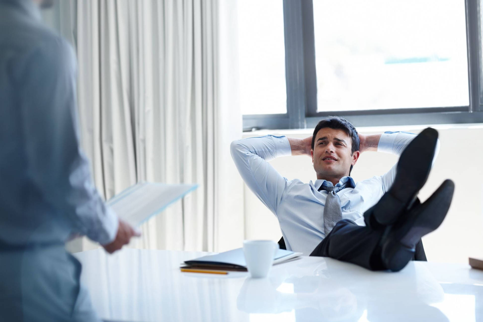 Arrogant Boss Nonchalantly Resting Feet On Office Desk Background