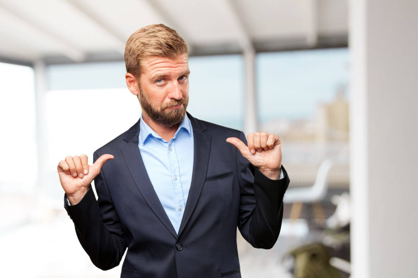 Arrogant Man With Thumbs Pointing To Self Background