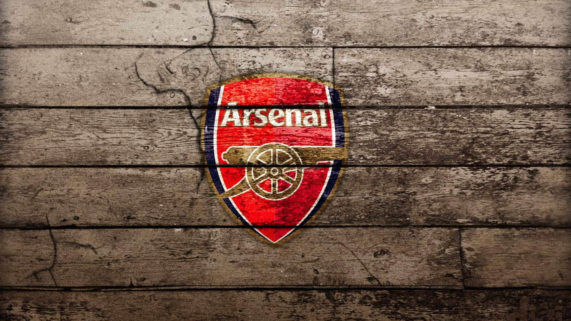 Arsenal Emblem On Wood Floor Background