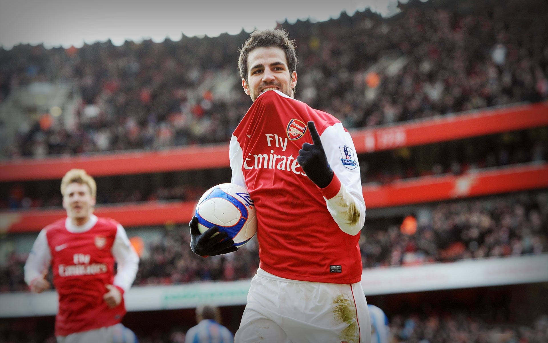 Arsenal Fc Players With The Ball Background