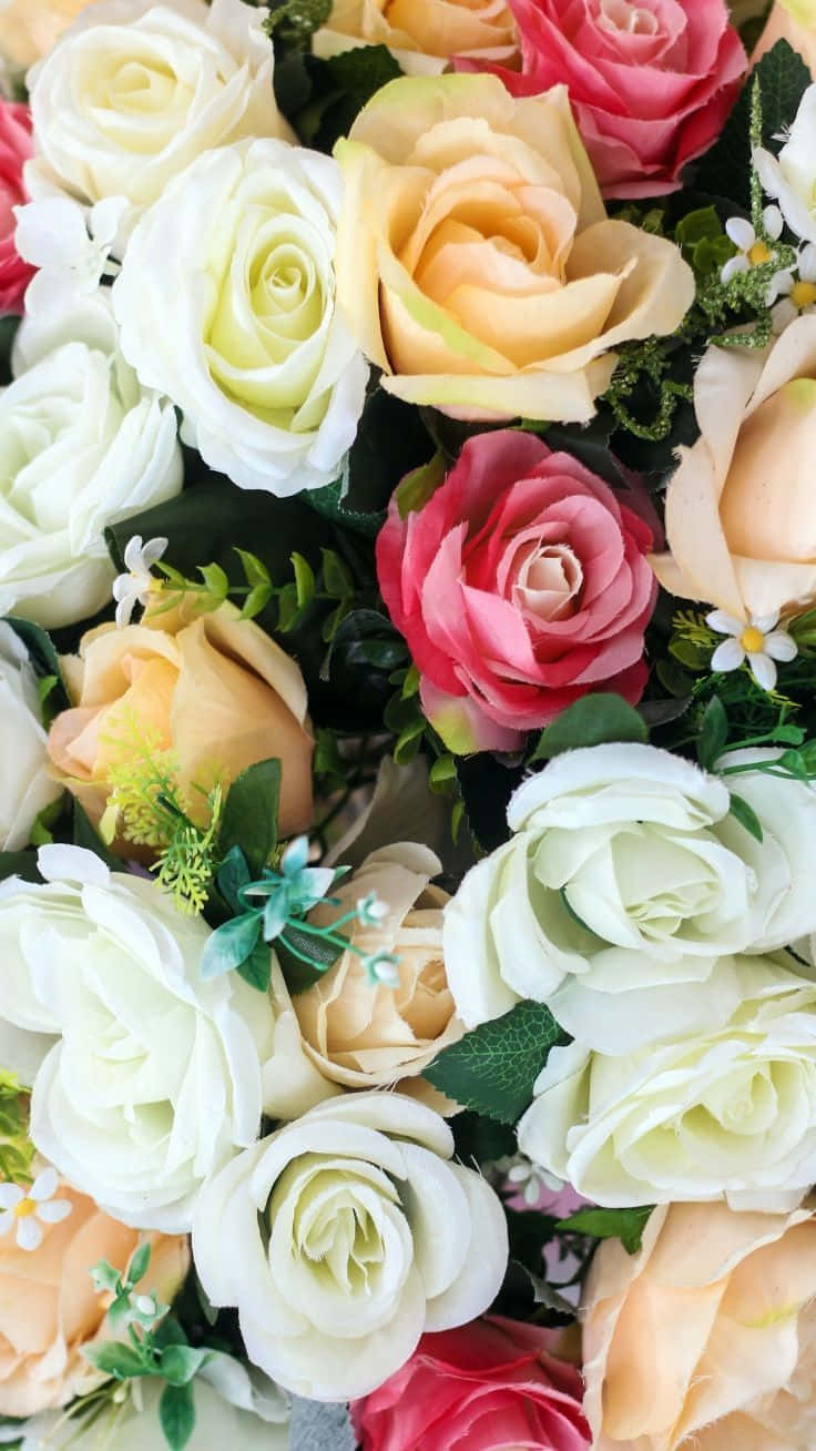 Artificial Roses In A Vase With Green Leaves Background
