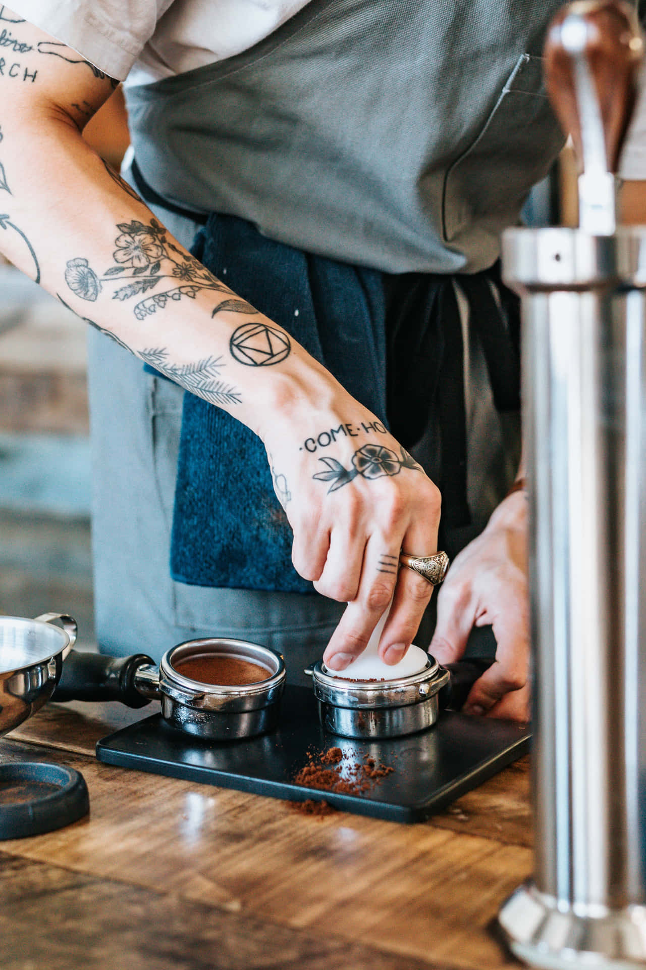 Artistic Hand Tattoo On A Barista Background