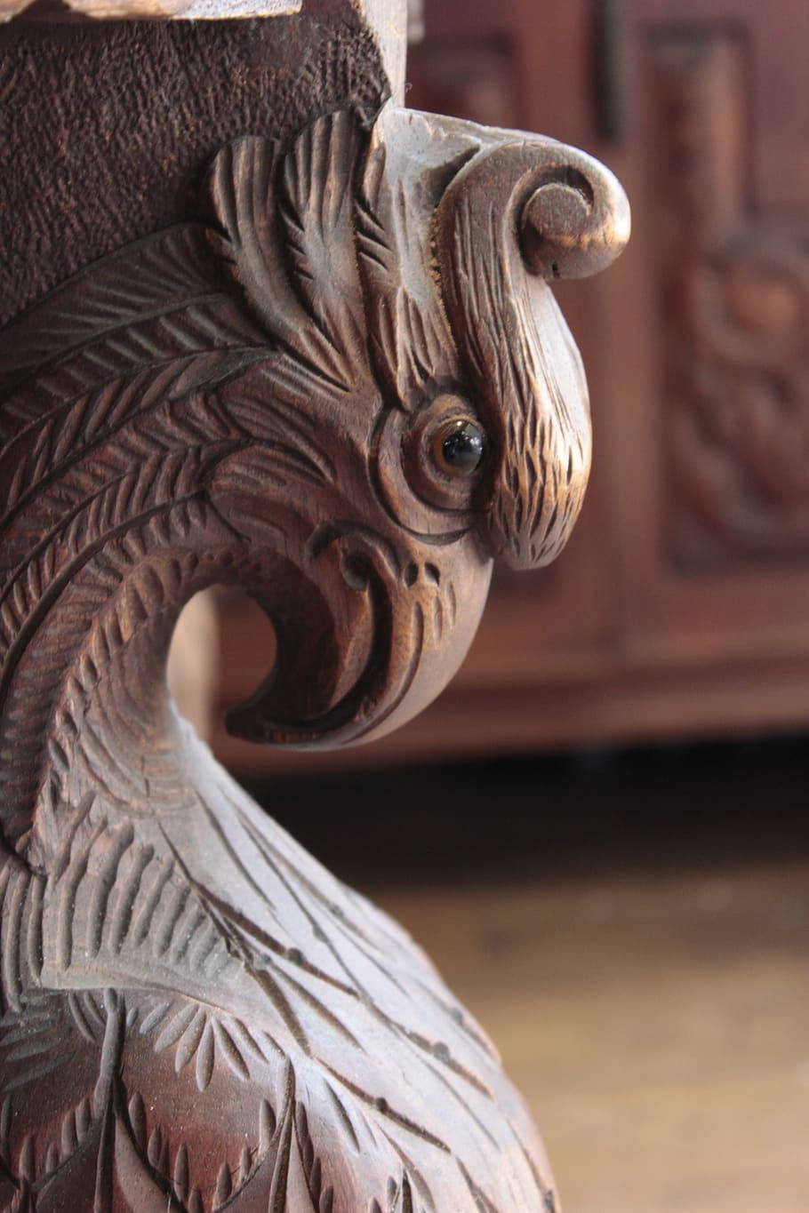 Artistic Wooden Aguila Sculpture In Building Environment Background