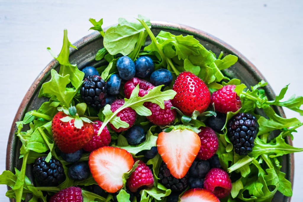 Arugula Leaves And Berries Salad Background