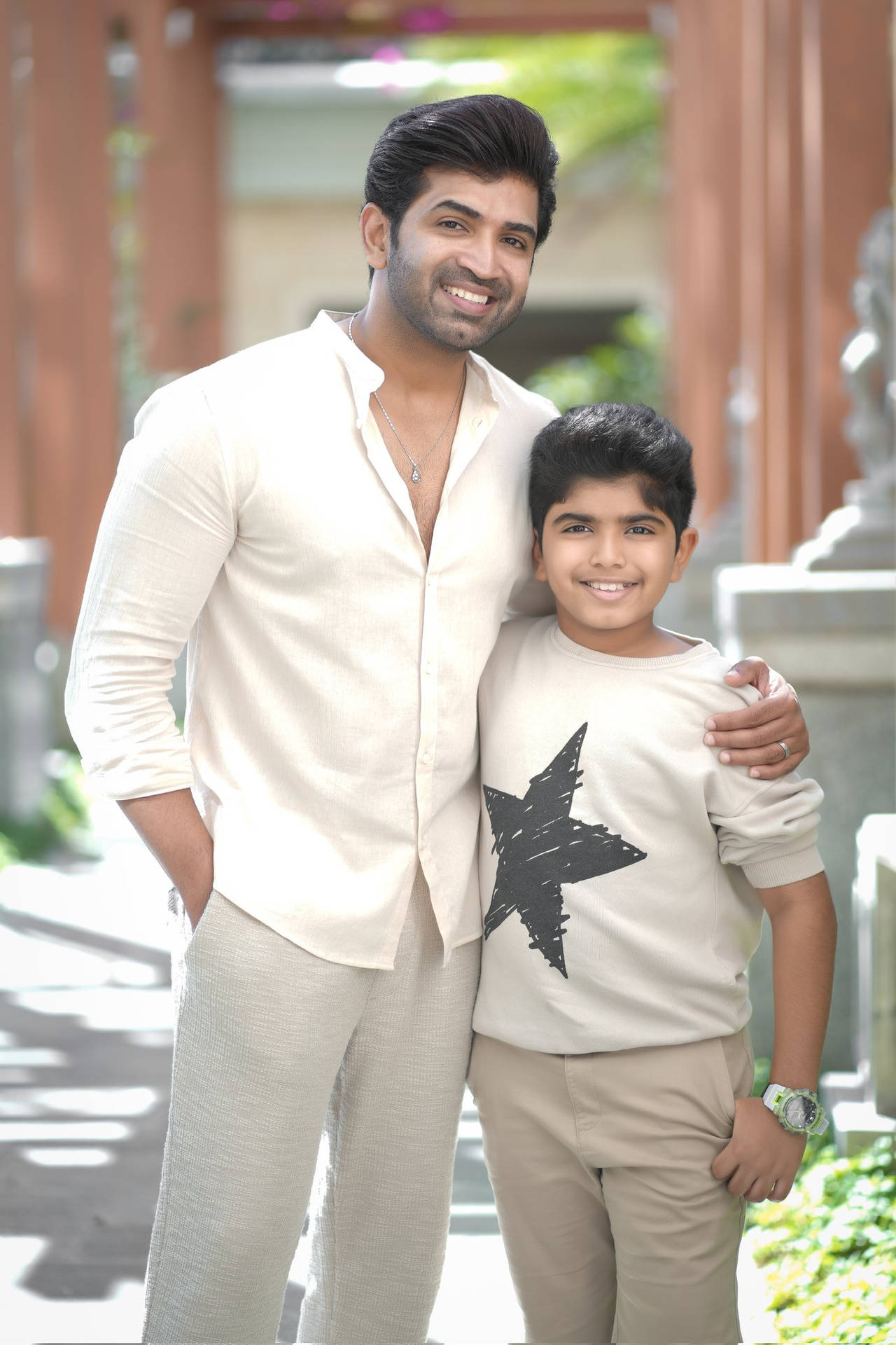 Arun Vijay Poses With A Young Fan Background